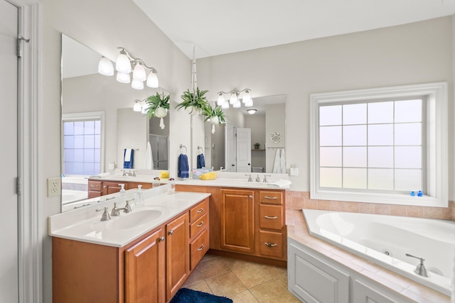 5109 Newbury Way, Columbia, MO 65203 - bathroom with tile patterned floors, a jetted tub, and vanity
