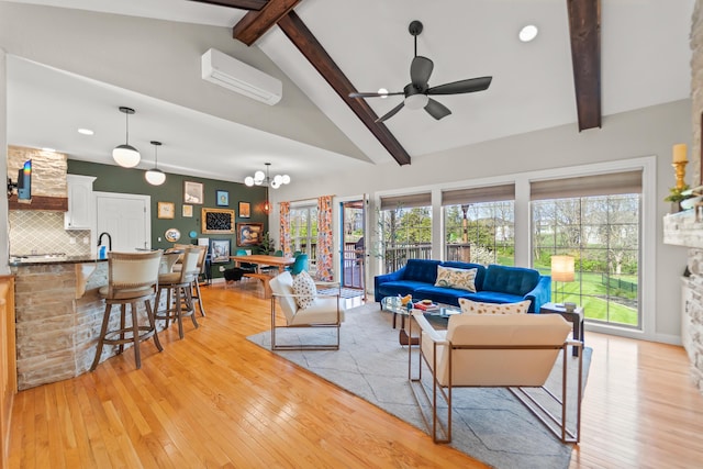 5109 Newbury Way, Columbia, MO 65203 - living area with an AC wall unit, beam ceiling, a healthy amount of sunlight, light wood finished floors, and ceiling fan with notable chandelier