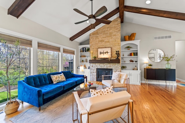 5109 Newbury Way, Columbia, MO 65203 - living area with light wood finished floors, beam ceiling, a ceiling fan, and visible vents