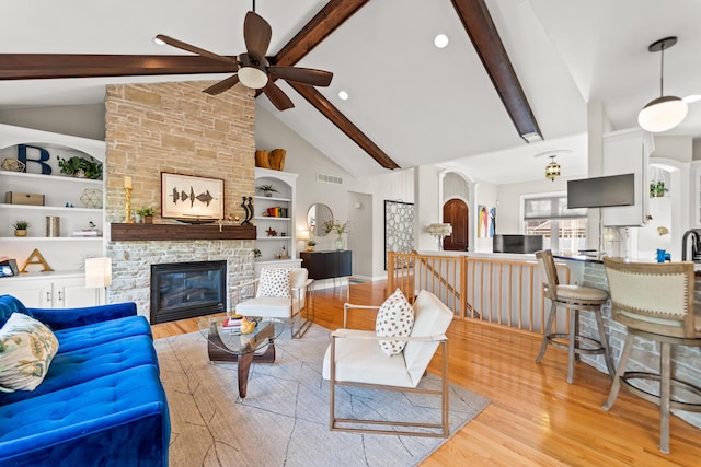 5109 Newbury Way, Columbia, MO 65203 - living area featuring visible vents, beam ceiling, ceiling fan, and wood finished floors