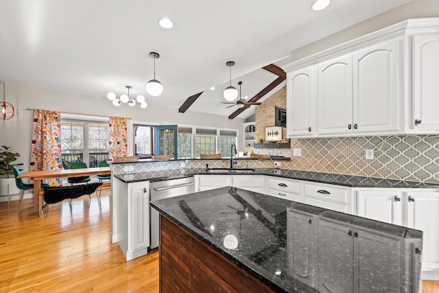 5109 Newbury Way, Columbia, MO 65203 - kitchen featuring white cabinets, stainless steel dishwasher, a peninsula, and a sink