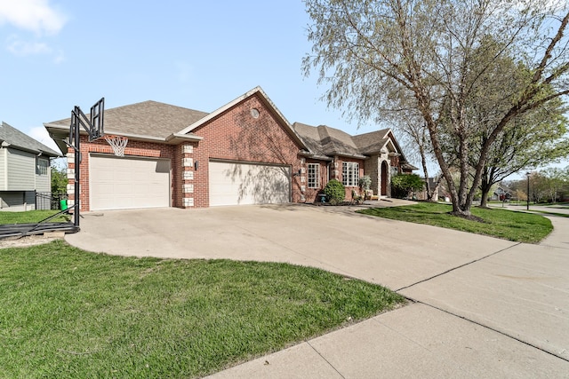 5109 Newbury Way, Columbia, MO 65203 - view of front facade with driveway, an attached garage, a front lawn, brick siding, and a shingled roof