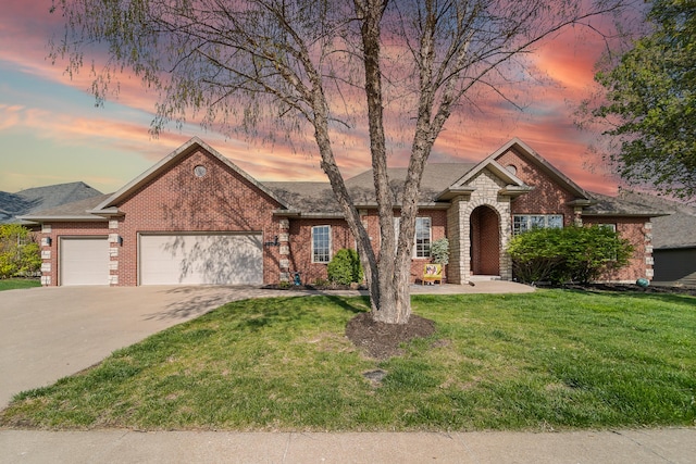 5109 Newbury Way, Columbia, MO 65203 - ranch-style home with a yard, an attached garage, brick siding, and concrete driveway