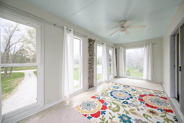unfurnished sunroom featuring tile patterned flooring