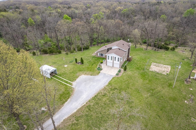 aerial view featuring a wooded view