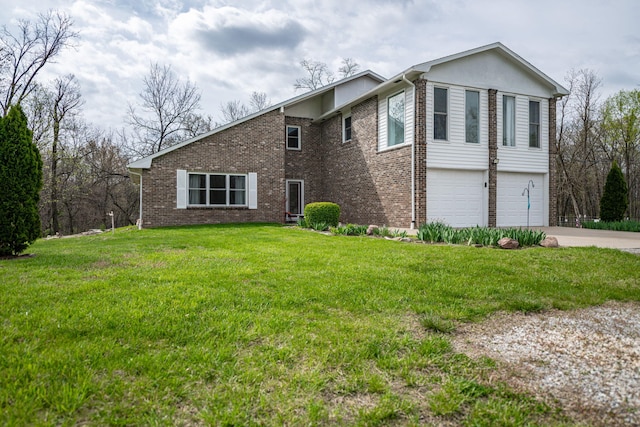 view of front of house featuring brick siding, a front lawn, driveway, and a garage