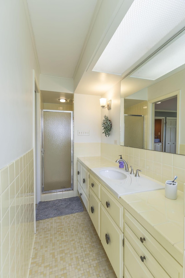 30 Holman Rd, Moberly, MO 65270 - bathroom featuring a stall shower, vanity, and tile walls