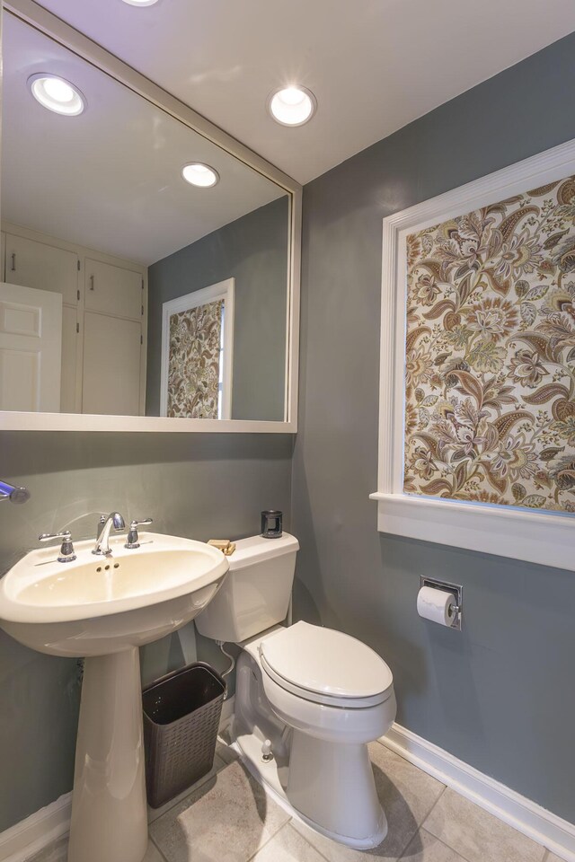 30 Holman Rd, Moberly, MO 65270 - bathroom featuring tile patterned floors, baseboards, a sink, and toilet
