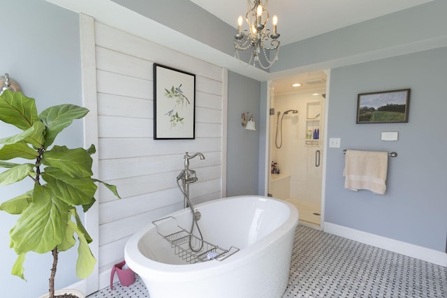 30 Holman Rd, Moberly, MO 65270 - bathroom featuring a soaking tub, baseboards, an inviting chandelier, and a stall shower