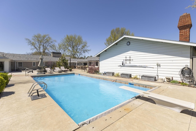 30 Holman Rd, Moberly, MO 65270 - pool with a patio and a diving board