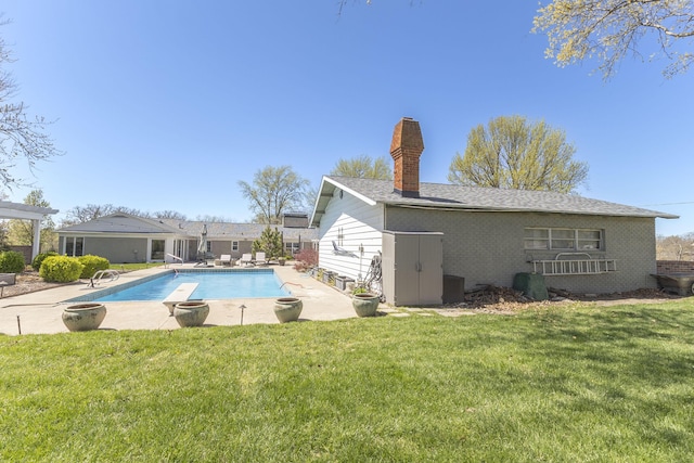 30 Holman Rd, Moberly, MO 65270 - pool with an outdoor fire pit, a patio, central AC, and a lawn