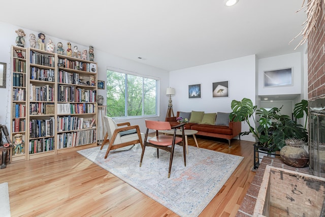 sitting room featuring wood finished floors