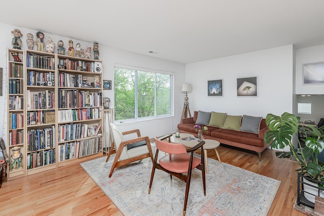 sitting room featuring wood finished floors
