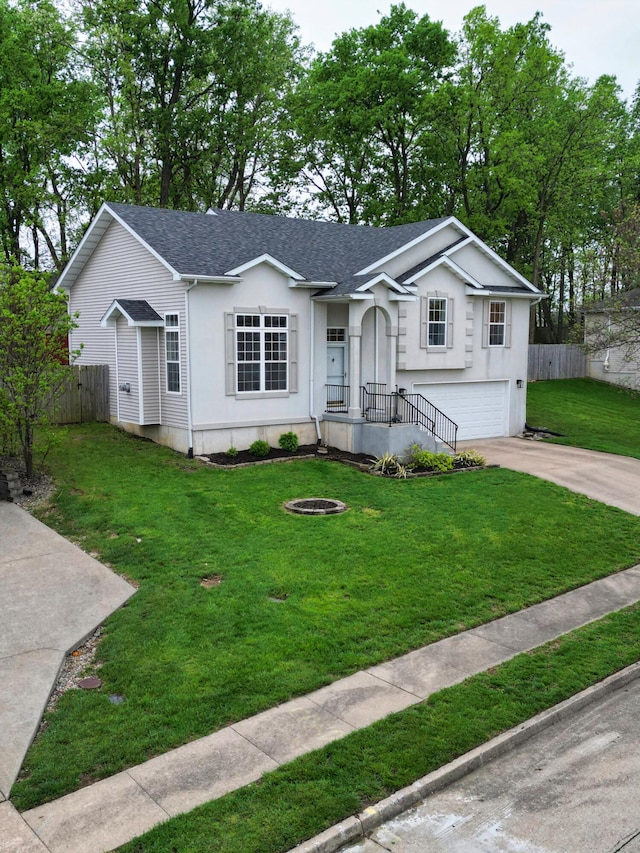 ranch-style home featuring fence, roof with shingles, a garage, a front yard, and concrete driveway