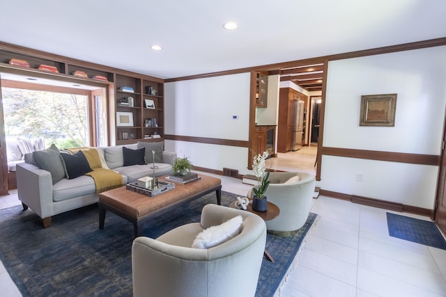living area with baseboards, ornamental molding, light tile patterned flooring, and recessed lighting
