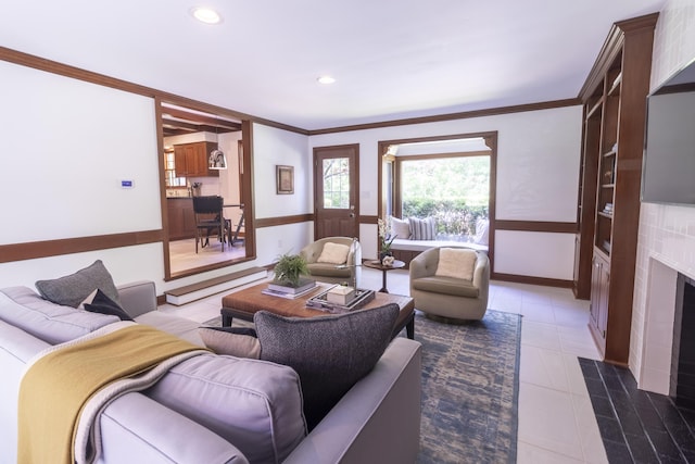 living area with ornamental molding, recessed lighting, baseboards, and tile patterned flooring