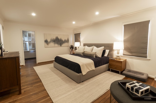 bedroom featuring ornamental molding, dark wood finished floors, recessed lighting, and baseboards