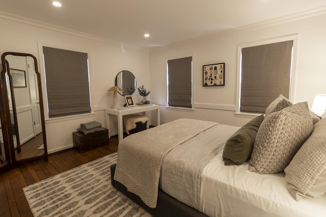 bedroom featuring wood-type flooring, crown molding, and recessed lighting