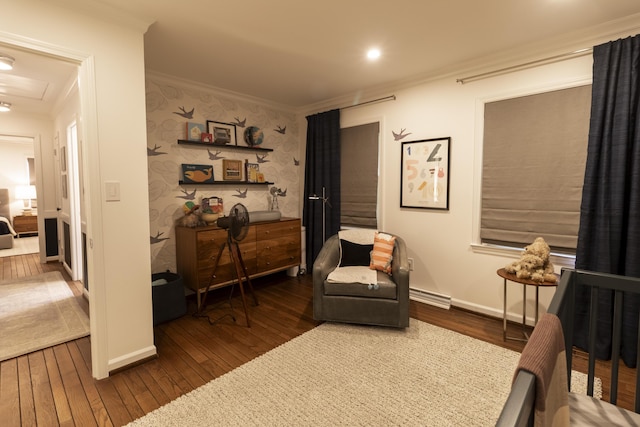 bedroom with ornamental molding, wood-type flooring, baseboards, wallpapered walls, and a baseboard heating unit