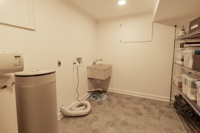 washroom with electric dryer hookup, ornamental molding, baseboards, and washer hookup
