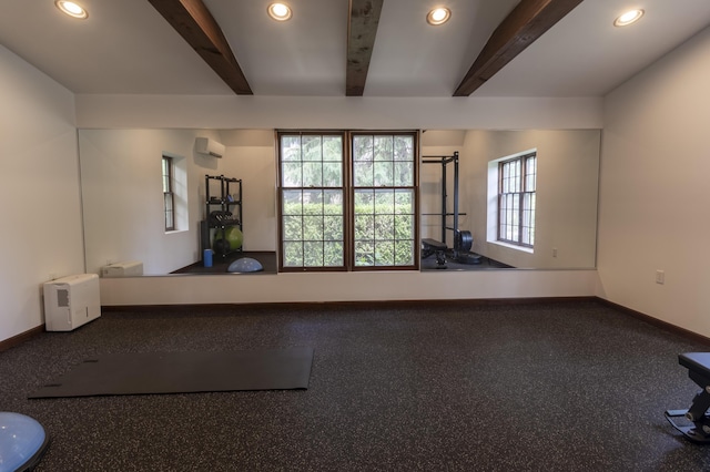 workout room with recessed lighting, baseboards, and a wall mounted air conditioner
