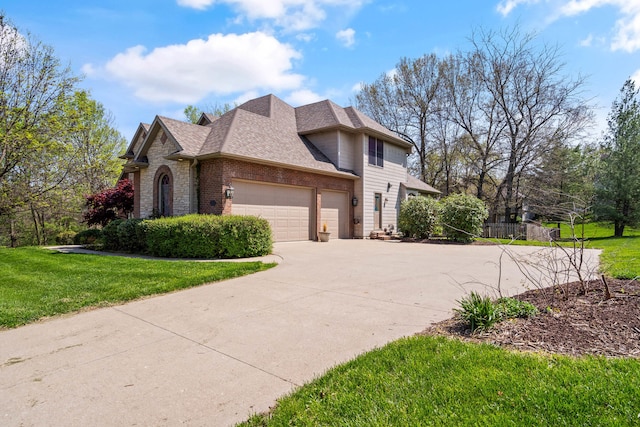 view of home's exterior with brick siding, a yard, an attached garage, and driveway