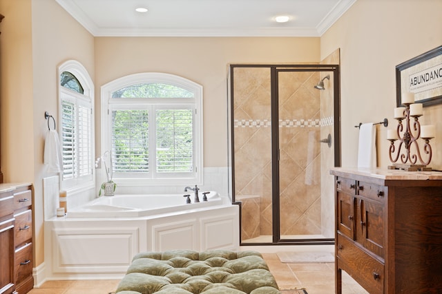 bathroom featuring a garden tub, crown molding, and a stall shower