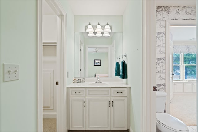 bathroom featuring toilet and vanity