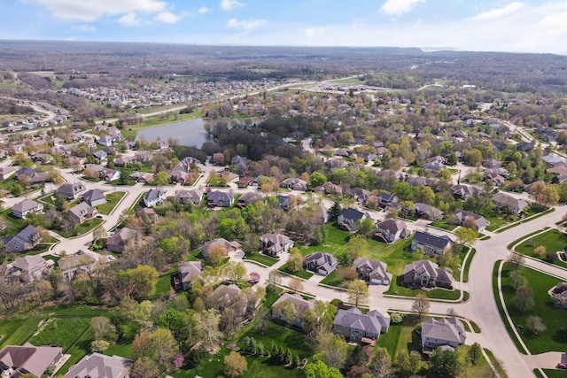 birds eye view of property with a residential view and a water view