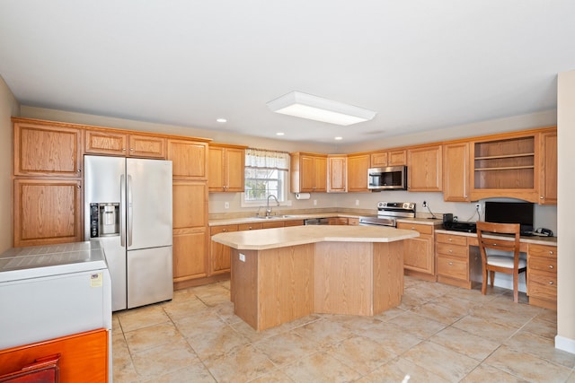 kitchen with open shelves, a sink, stainless steel appliances, light countertops, and a kitchen island