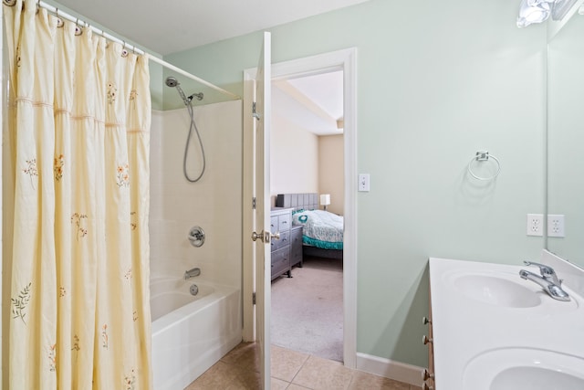 full bath featuring tile patterned floors, shower / tub combo with curtain, a sink, and double vanity