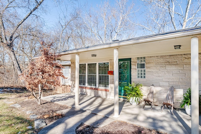 property entrance with covered porch