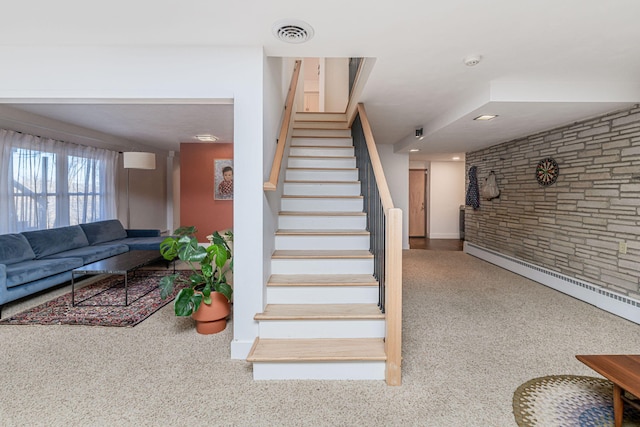 stairs with baseboards, visible vents, and carpet