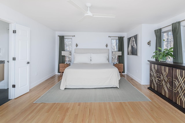 bedroom with baseboards, a ceiling fan, and wood finished floors