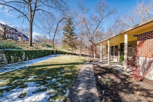 view of yard featuring fence and a patio