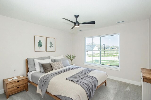 709 Sagemoor Dr, Columbia, MO 65201 - bedroom featuring visible vents, baseboards, ceiling fan, and light colored carpet