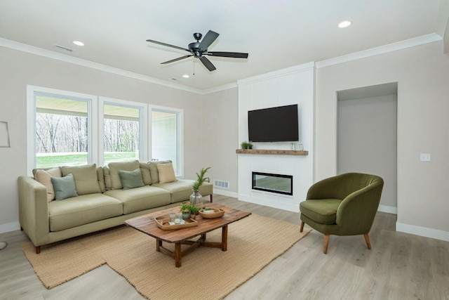 709 Sagemoor Dr, Columbia, MO 65201 - living room with a fireplace, light wood-style floors, visible vents, and baseboards
