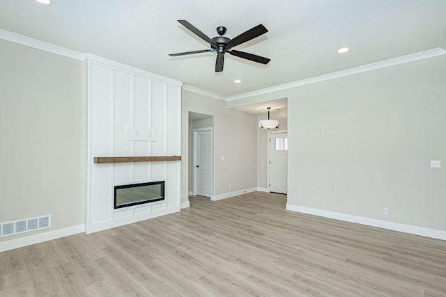 709 Sagemoor Dr, Columbia, MO 65201 - unfurnished living room featuring light wood finished floors, visible vents, ornamental molding, baseboards, and ceiling fan