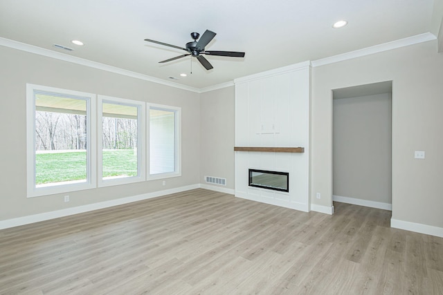 709 Sagemoor Dr, Columbia, MO 65201 - unfurnished living room with light wood-type flooring, visible vents, crown molding, and baseboards