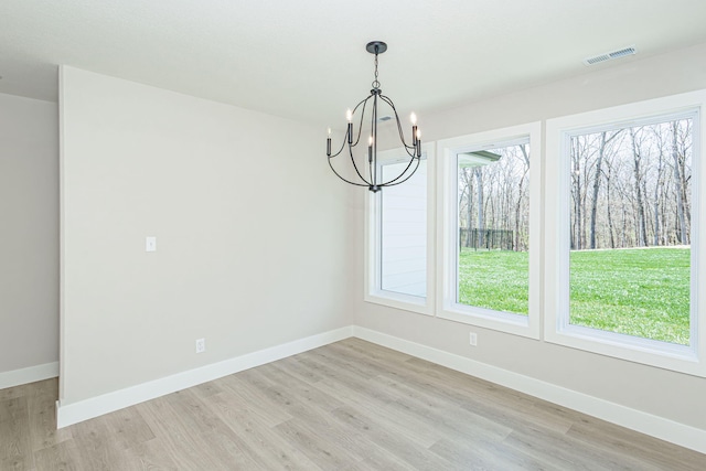 709 Sagemoor Dr, Columbia, MO 65201 - unfurnished dining area featuring light wood-type flooring, visible vents, and a chandelier