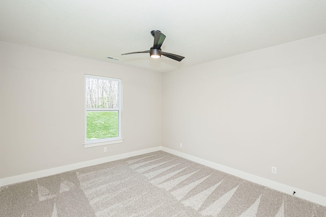 709 Sagemoor Dr, Columbia, MO 65201 - spare room featuring carpet, visible vents, a ceiling fan, and baseboards