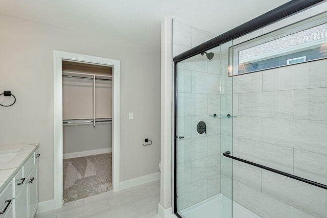 709 Sagemoor Dr, Columbia, MO 65201 - full bathroom featuring baseboards, vanity, toilet, and a stall shower