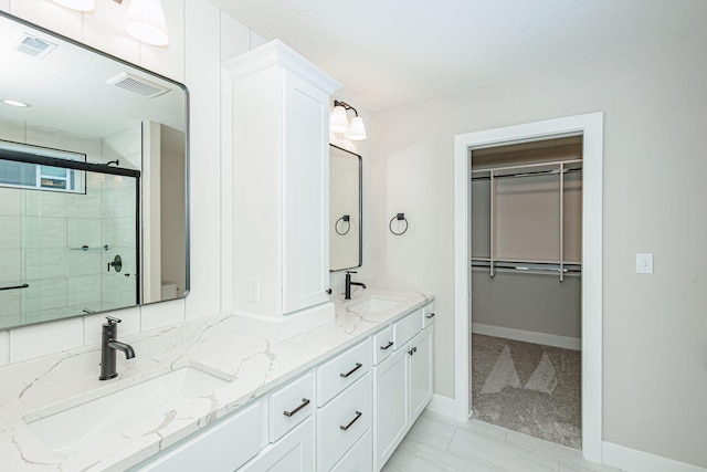 709 Sagemoor Dr, Columbia, MO 65201 - full bathroom with visible vents, a stall shower, and a sink