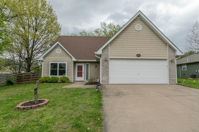 3701 Churchill Dr, Columbia, MO 65201 - single story home featuring concrete driveway, an attached garage, fence, central AC, and a front lawn