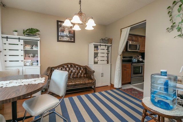 3701 Churchill Dr, Columbia, MO 65201 - dining area featuring a chandelier and light wood-style floors