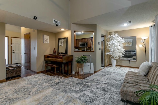 3701 Churchill Dr, Columbia, MO 65201 - living area with baseboards, visible vents, and wood finished floors