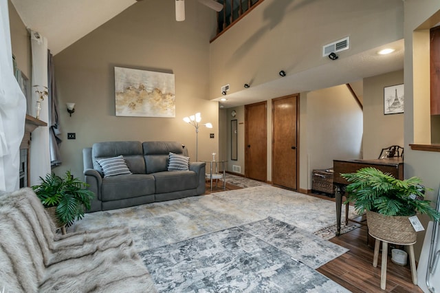 3701 Churchill Dr, Columbia, MO 65201 - living area featuring visible vents, wood finished floors, a ceiling fan, and a high ceiling