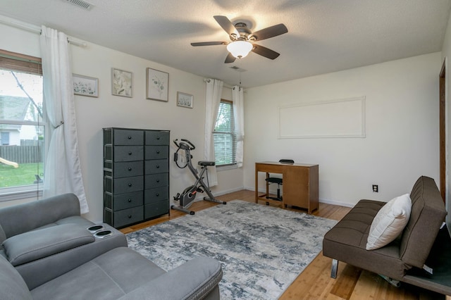 3701 Churchill Dr, Columbia, MO 65201 - living room with baseboards, visible vents, wood finished floors, and ceiling fan
