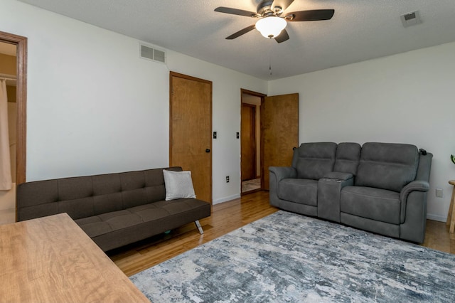 3701 Churchill Dr, Columbia, MO 65201 - living room featuring visible vents, wood finished floors, and ceiling fan