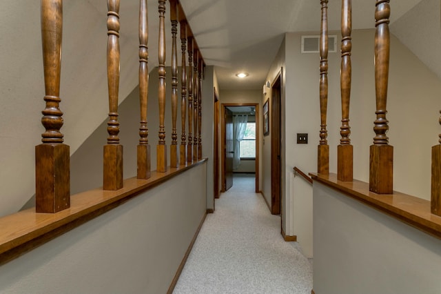 3701 Churchill Dr, Columbia, MO 65201 - corridor featuring an upstairs landing, visible vents, baseboards, and carpet floors